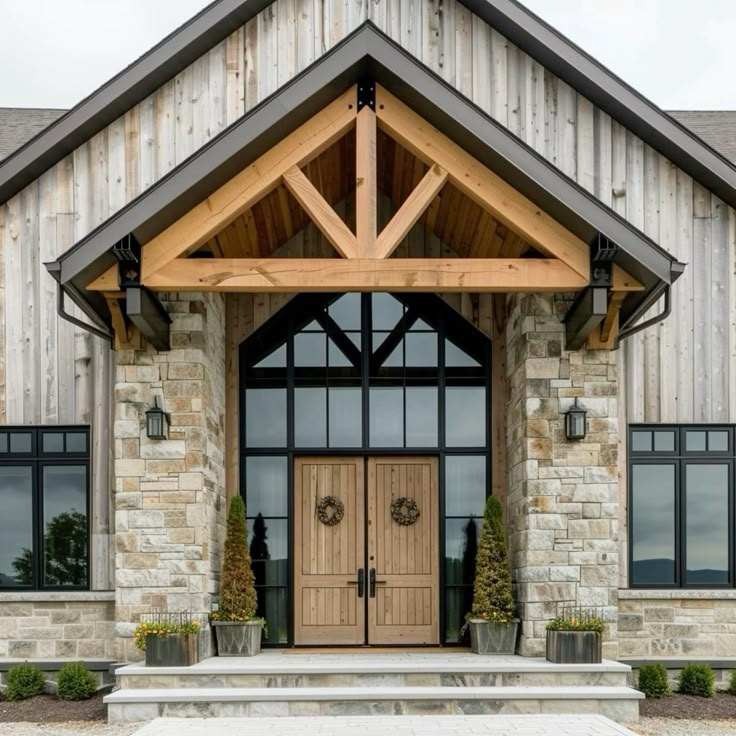 A wood house with wooden door and stone entryway