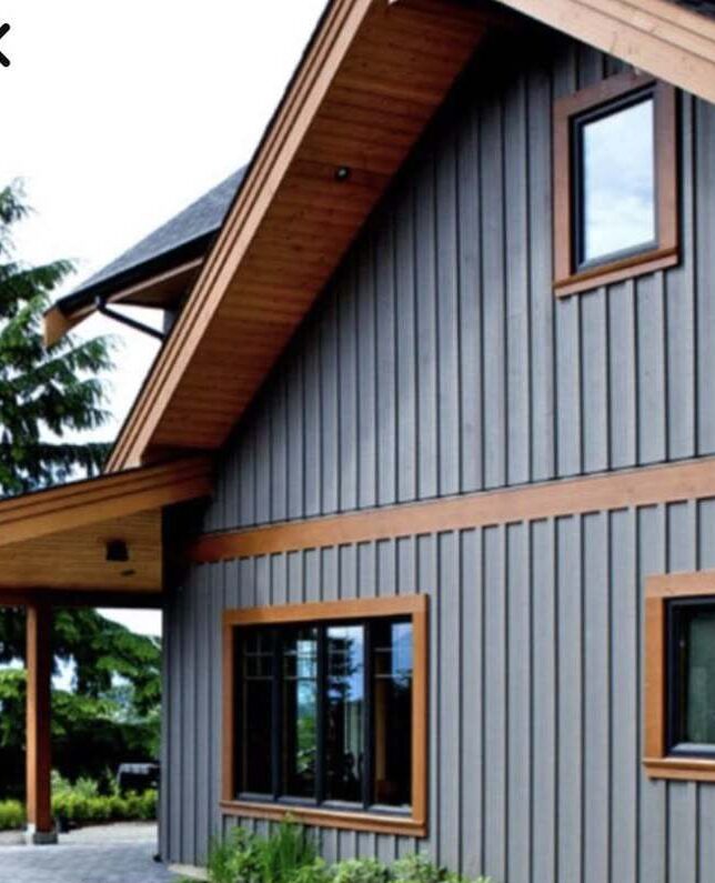 Wooden trim and windows on grey house