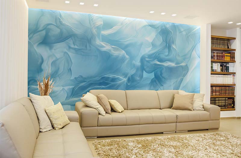 A white living room and white and blue wallpaper and soda and book shelves