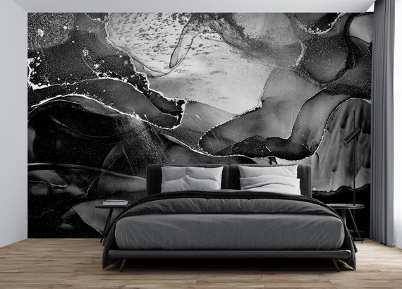 A black and white wallpaper and black bed and wooden floor 