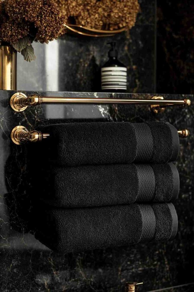 A black bathroom and towels rack