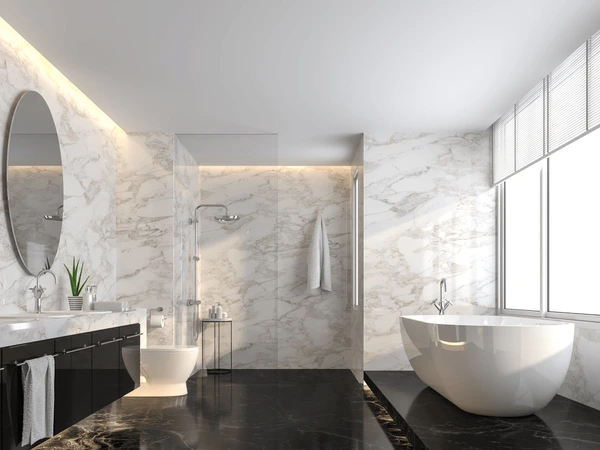 A black flooring and white wall in bathroom and white bathtub