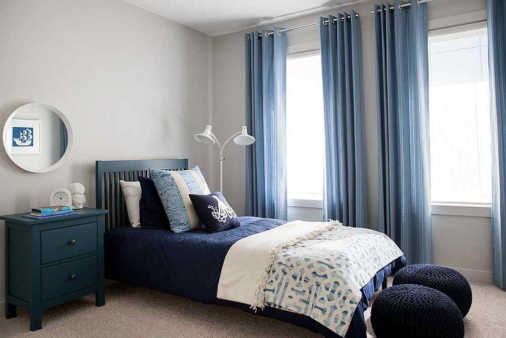 A grey living room with blue and grey accents 
