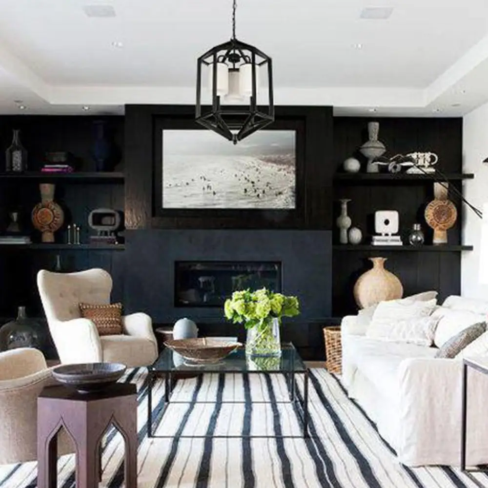 A crystal chandelier in white and black room