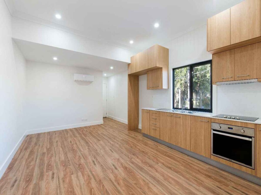 A wooden floor with black framed glass windows