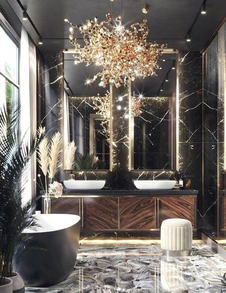 A chandelier above on the wall in bathroom
