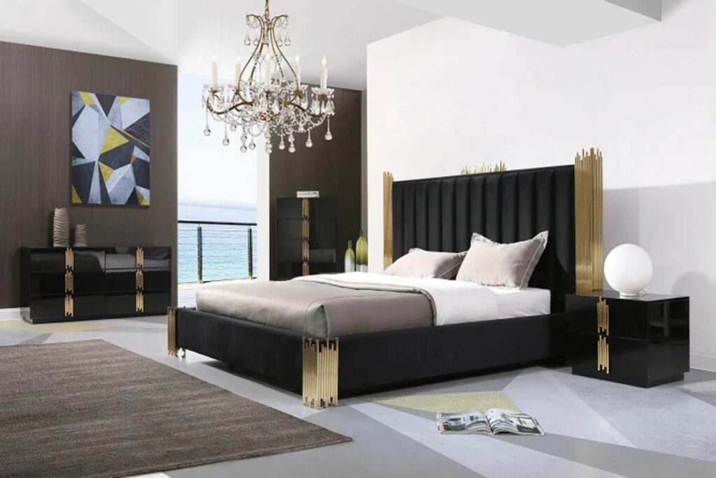 A black bed with gold nightstand