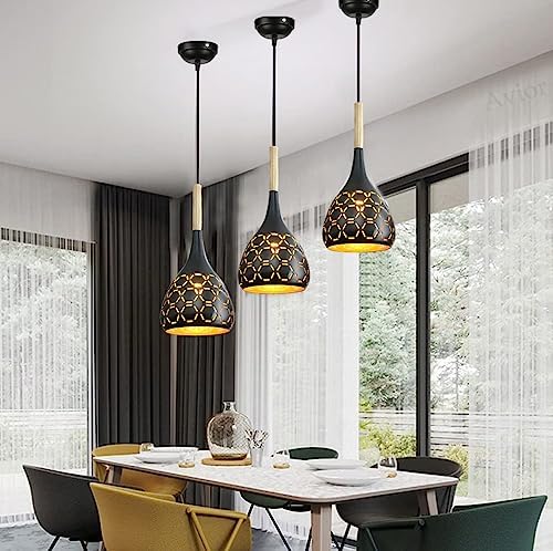 A hang lamps above the wall and a dining table