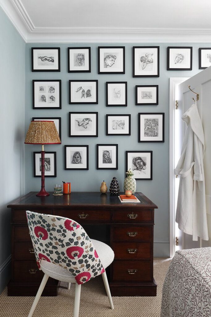  living room with frames wall and wooden table and chair 