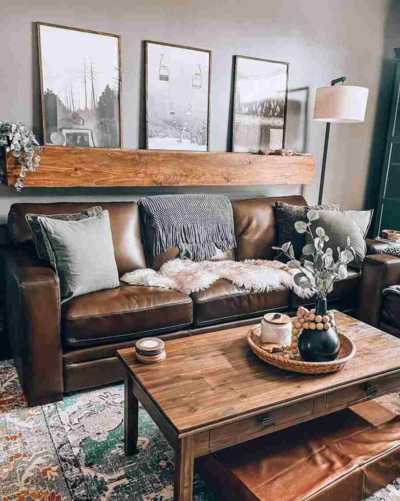 A rustic brown sofa with cushion and table