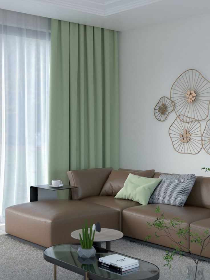 A green curtains and sofa cushion and table