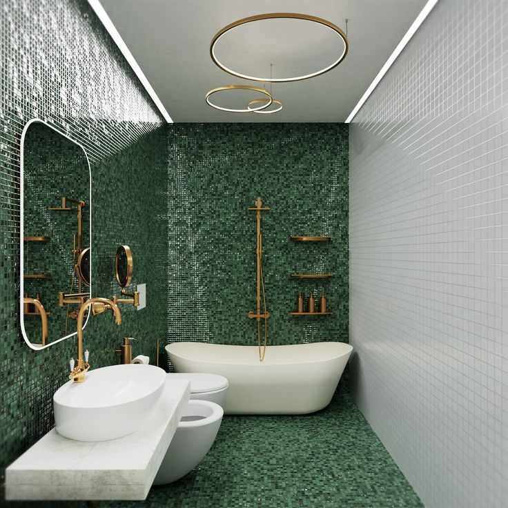 A green bathroom with white bathtub and sink with gold fixtures 