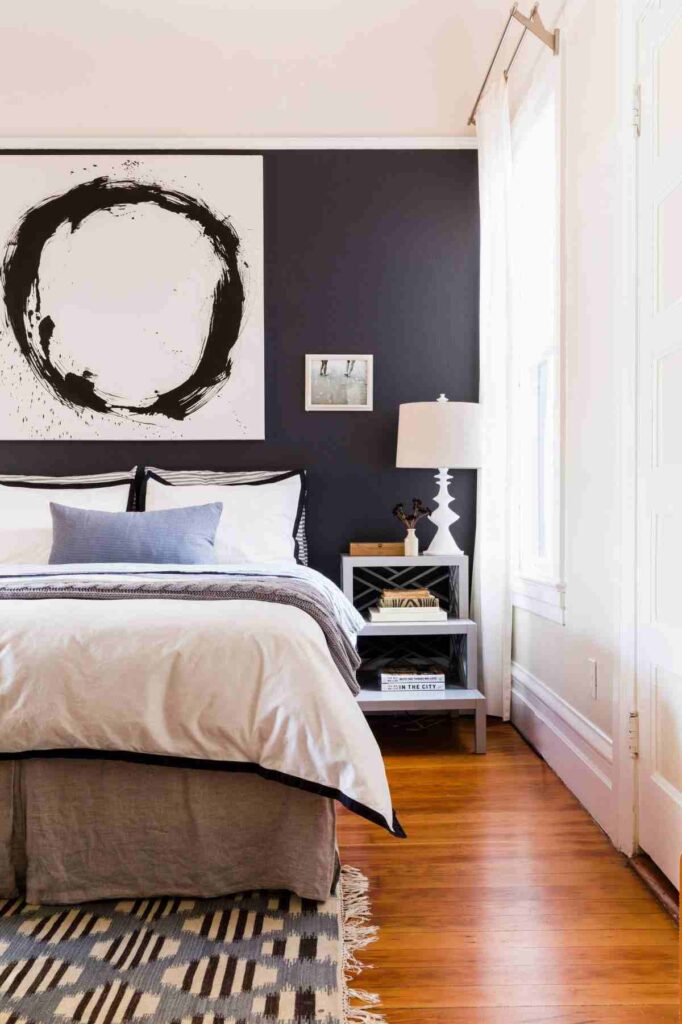 White and black bedroom and white lamp on the side table 