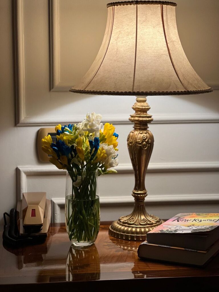 Antique lamp on the table with flower 