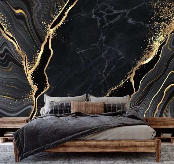 A black bedroom with gold and black wallpaper