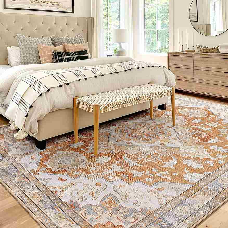 Vintage rug in white bedroom and wooden dresser  with wall mirror 
