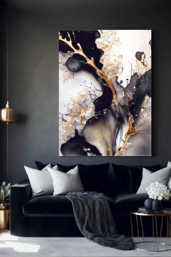 White and gold artwork in black living room and sofa with white cushion