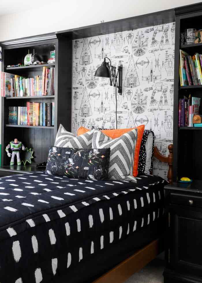 A black bookshelves with white bedroom 