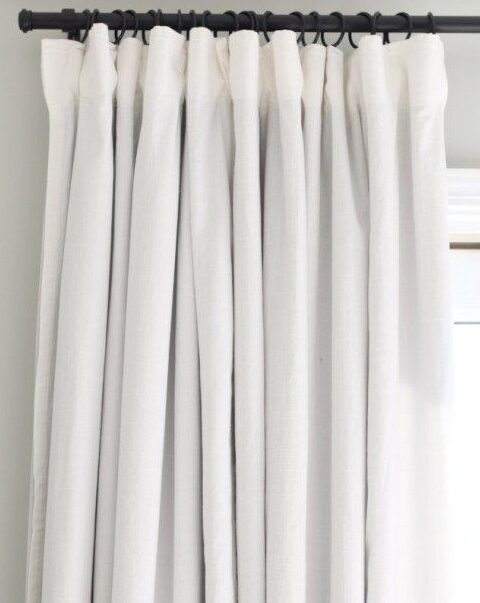 A white curtains with black rod 