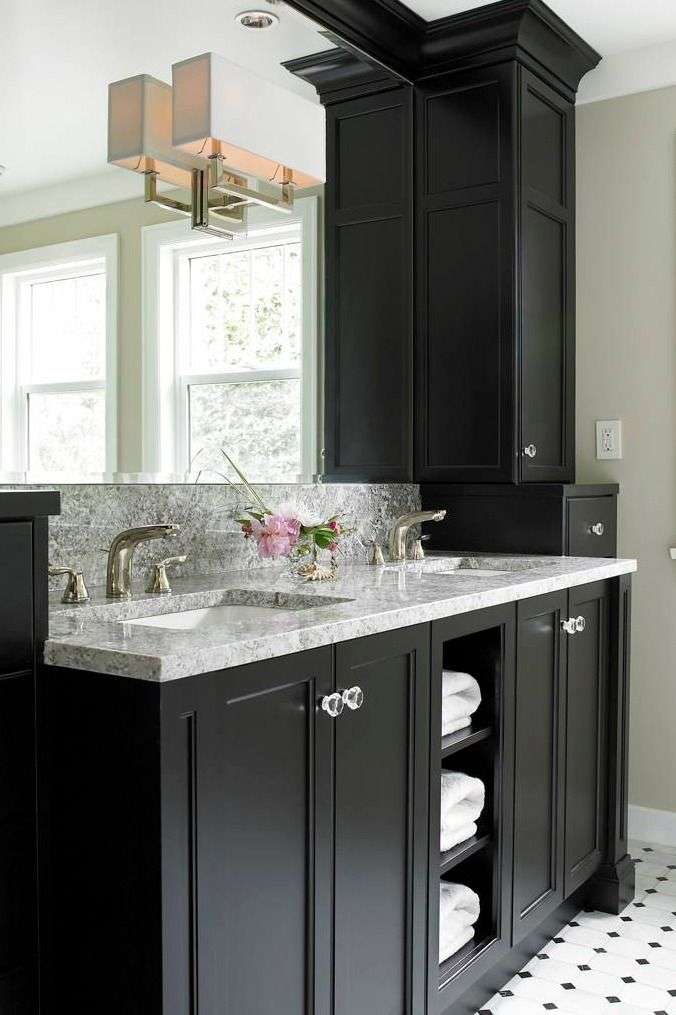 A bathroom with grey vanity and white marble counter top 