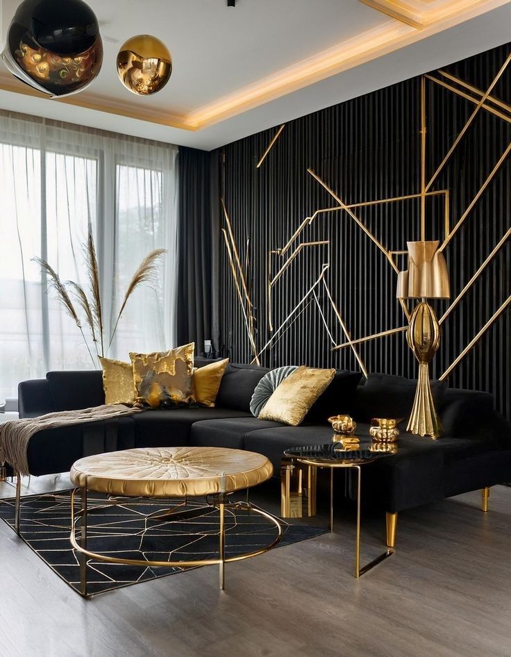A black living with gold accents and wooden floor and table