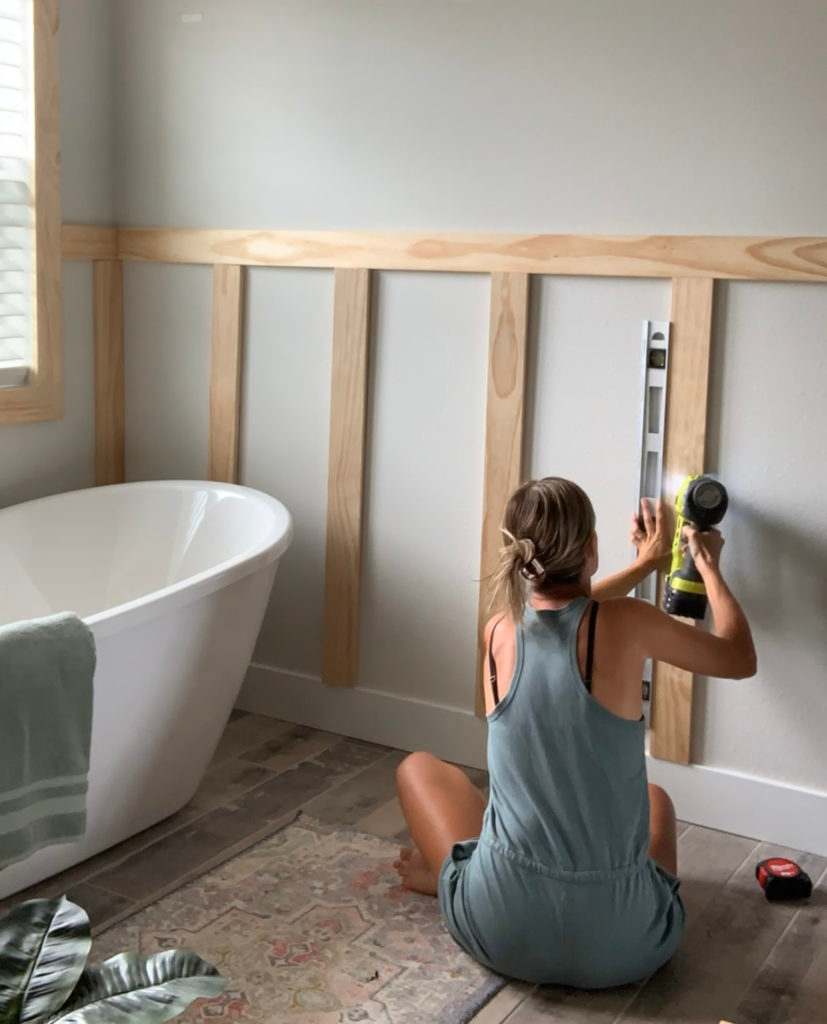 A board and batten bathroom and bathtub in the bathroom