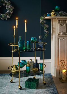 A green living room with candles