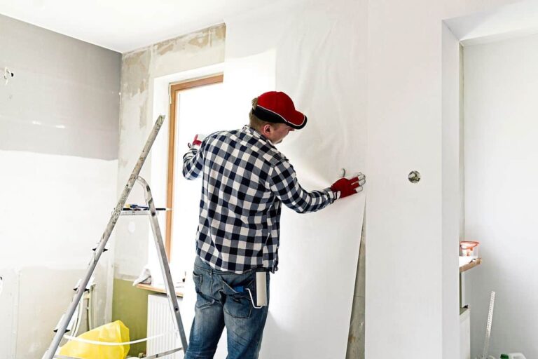 a person fixing the wall