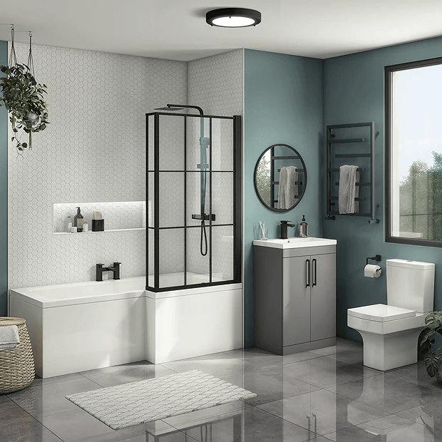 A sage and grey bathroom with white accents and glass windows and mirror on the wall 