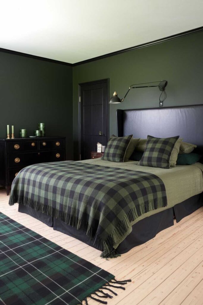 A green and black bedroom and  plaid textile on bed 