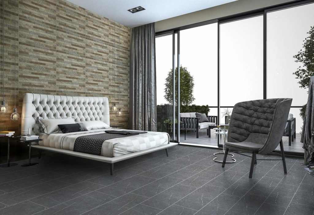 A white and grey tiles flooring in bedroom with glass windows 