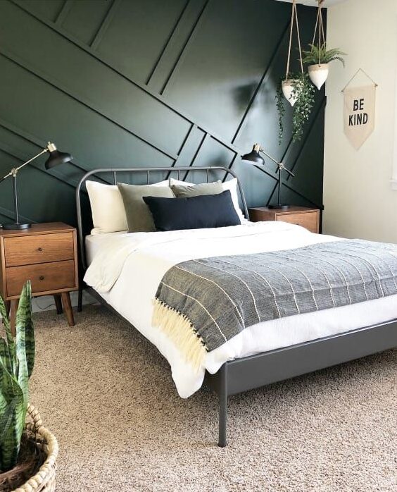 A Diagonal batten wall in bedroom with grey framed bed with wooden nightstand 