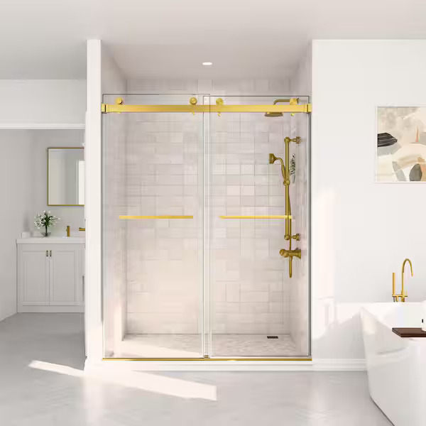 A white bathroom with gold framed shower gate and white bathtub 