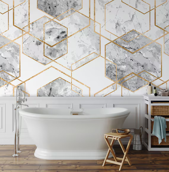 A white and gold wallpaper in bathroom and white bathtub and wooden floor 