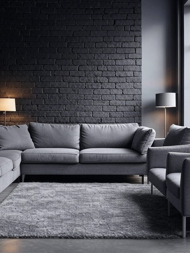 A black brick wall in grey living room with and grey rug 
