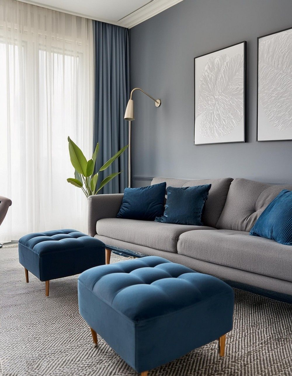 A grey and blue living room with metallic light on the wall 