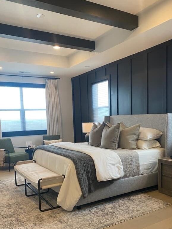 A black and  grey with beige accents and wooden floor and rug on it 