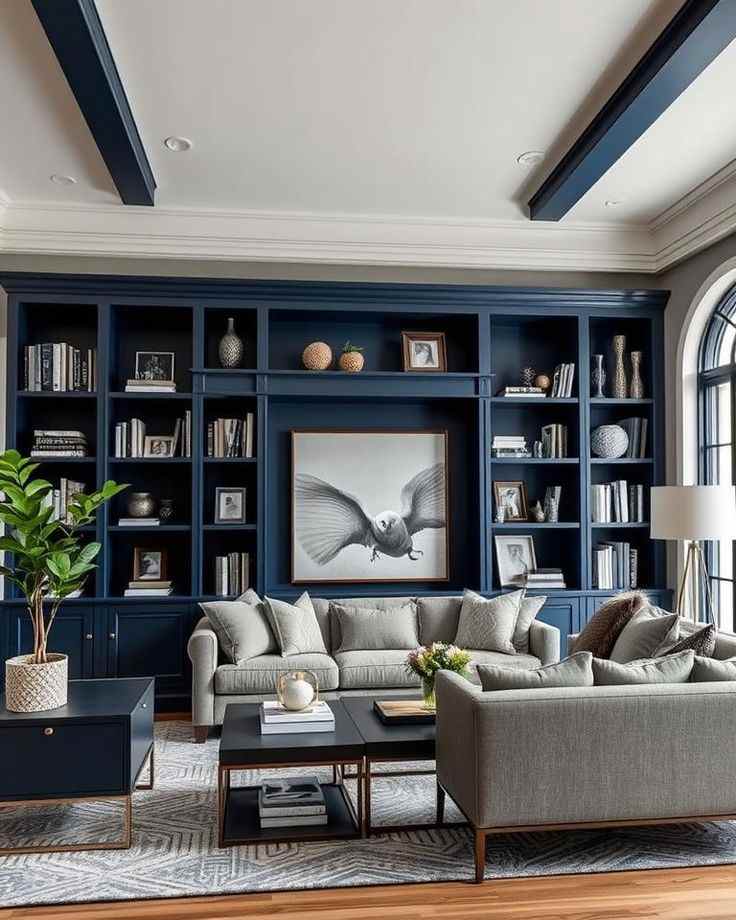 A navy blue wall with shelves and grey sofa with cushion and wooden floor and rug on it 