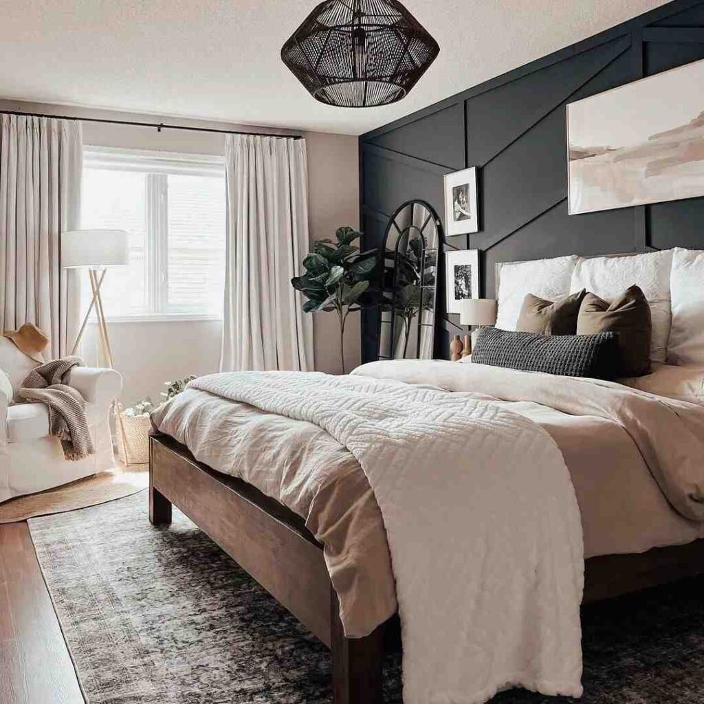 A black accent wall and grey wall and wooden floor and rug on it 