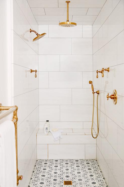 A white bathroom gold shower kit 