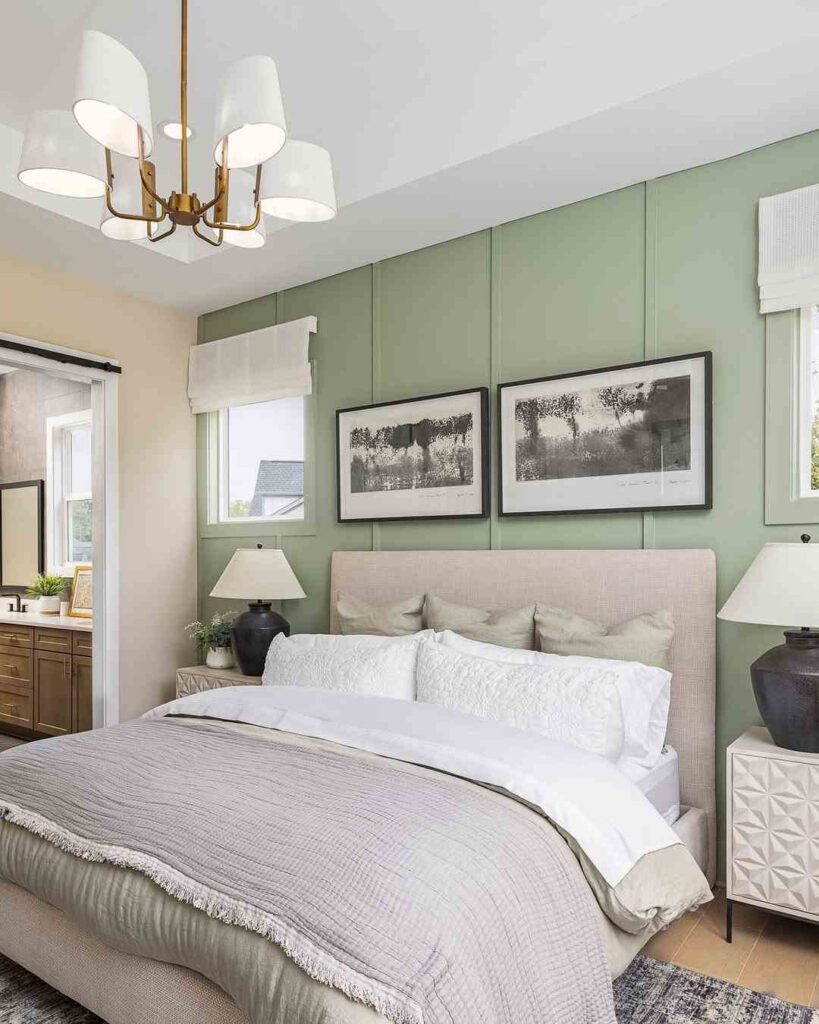 sage green bedroom with cream bedding and pillow and blanket 