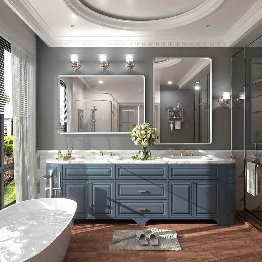 A blue vanity with grey wall and mirror on it and light fixture wooden floor 