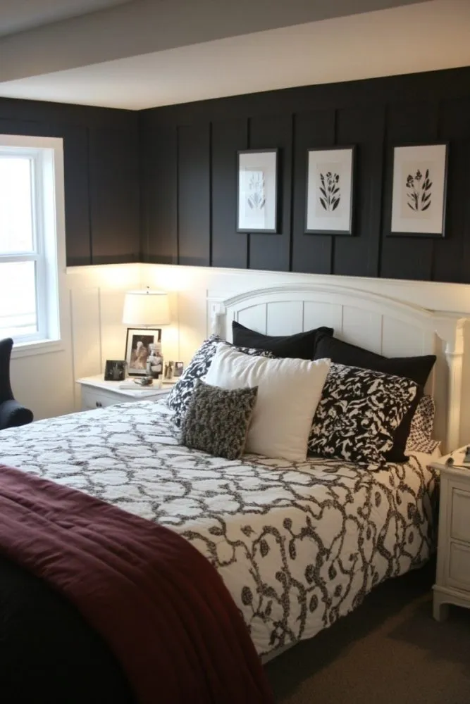 A board and batten bedroom with bed and blanket and pillow 