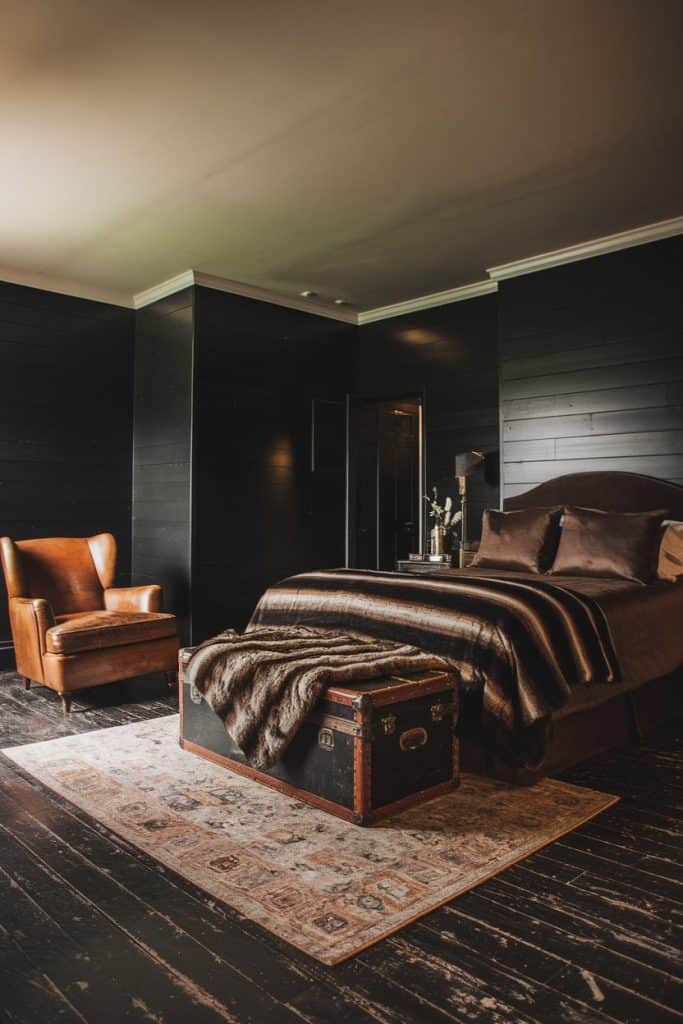 A black bedroom with brown bed and black flor and rug on it 