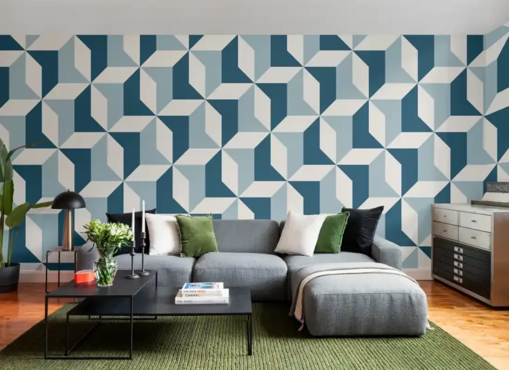 A blue geometric wallpaper in living room with grey sofa and cushion and wooden floor 