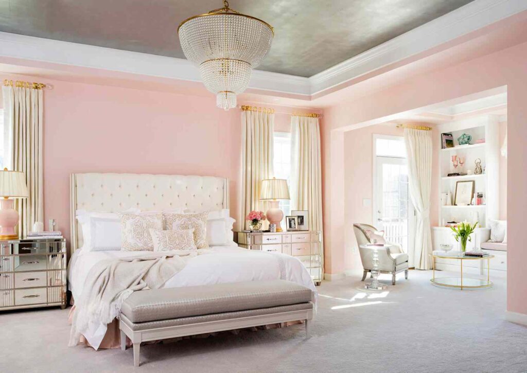 A pink and white bedroom with beige  accents 