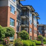 a-modern-family-apartment-and-small-trees-with-sidewalk-area