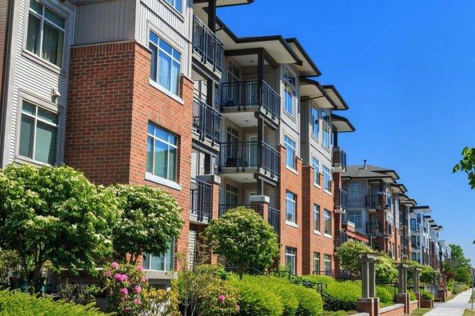 Red Flags to Watch For Before Buying in an HOA Community a-modern-family-apartment-and-small-trees-with-sidewalk-area