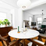 light-colored-dining-table-with-four-modern-wooden-chairs
