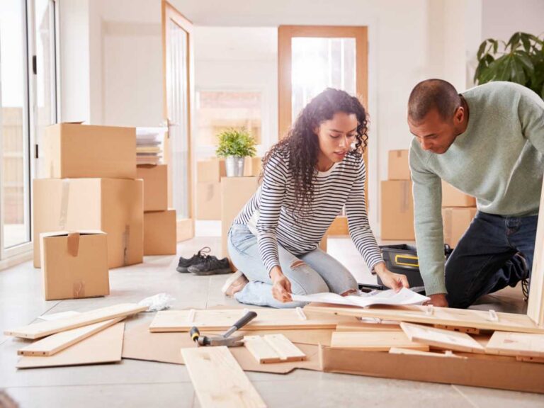 a-girl-and-boy-is-reading-a-book-and-doing-planning-of-home-renovation